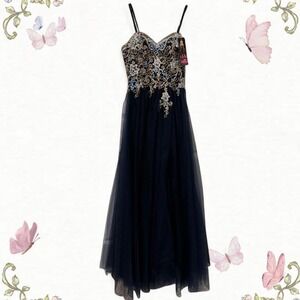 Navy blue tulle A-line gown with gold embroidery, strapless, and ribbon back